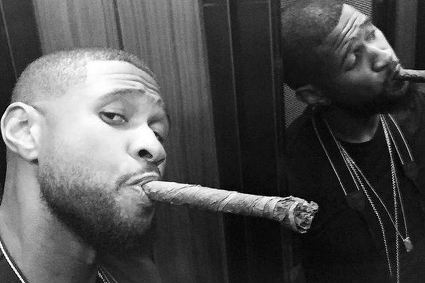 Usher fumó habanos. (INSTAGRAM) 