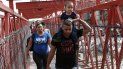 Migrantes cubanos son escoltados por las autoridades migratorias mexicanas en Ciudad Juárez, mientras cruzan el puente internacional Paso del Norte para ser procesados como solicitantes de asilo en el lado estadounidense de la frontera. Migrantes cubanos son escoltados por las autoridades migratorias mexicanas en Ciudad Juárez, mientras cruzan el puente internacional Paso del Norte para ser procesados como solicitantes de asilo en el lado estadounidense de la frontera.